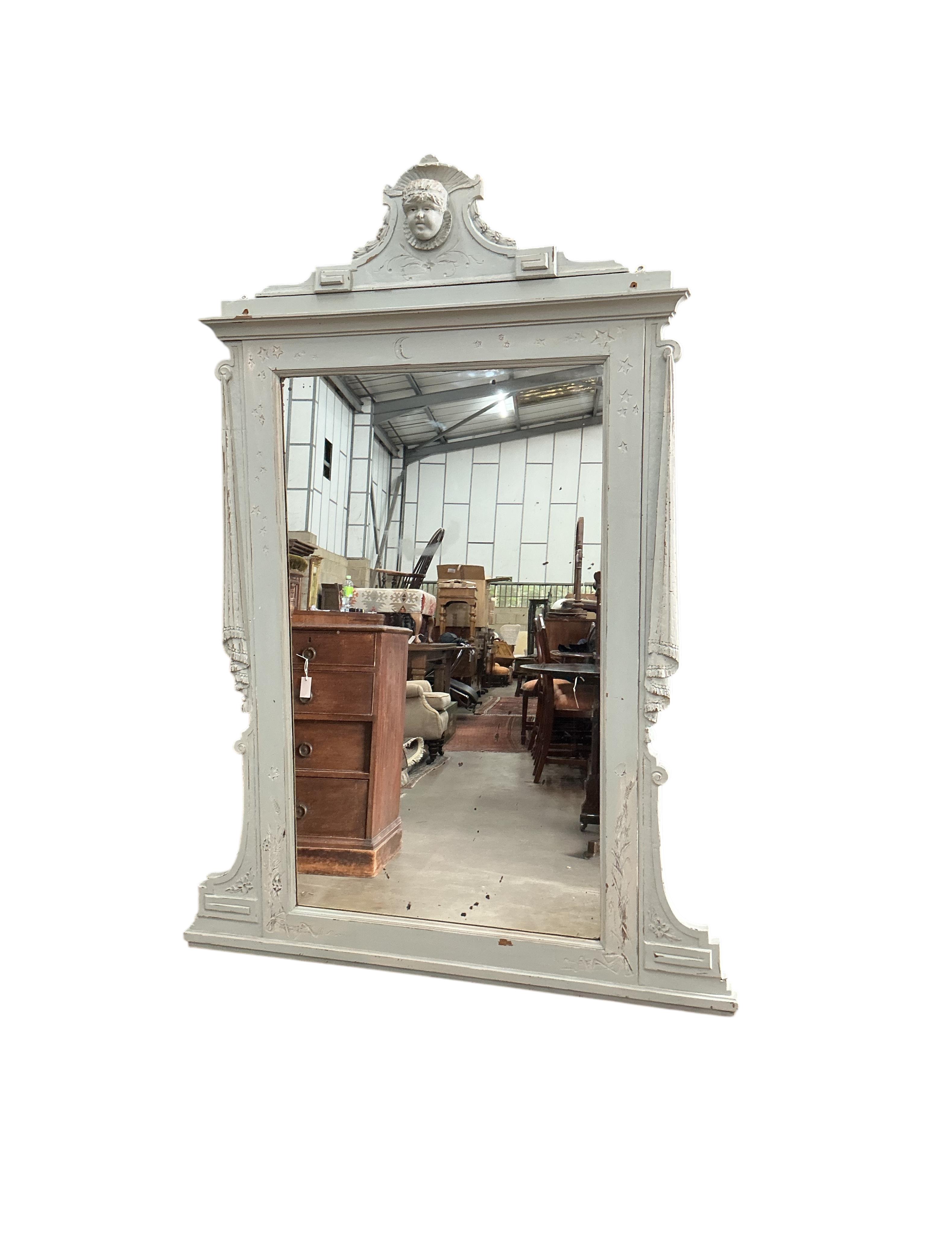 A 19th century Sicillian painted overmantel mirror, with cherub's head pediment, width 136cm, height 184cm
